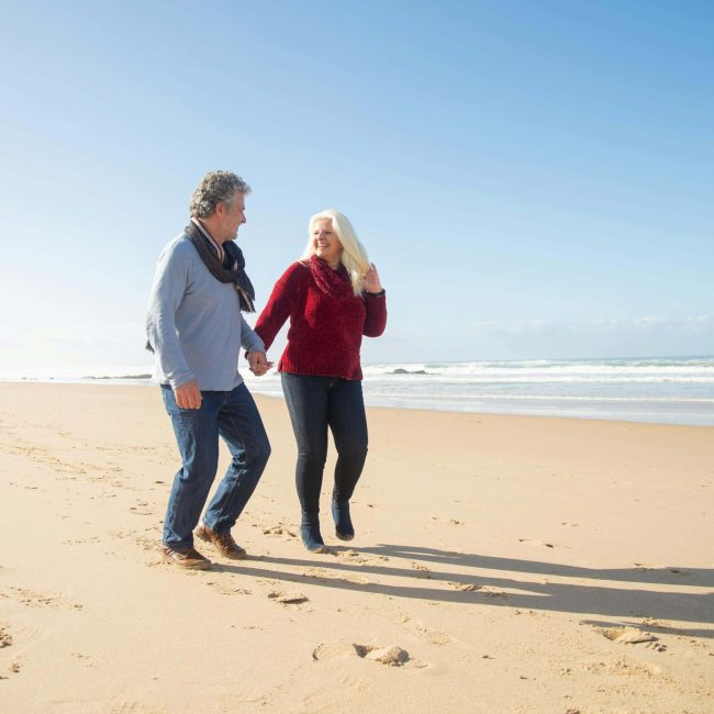 Expat couple at the beach Spain's Golden Visa